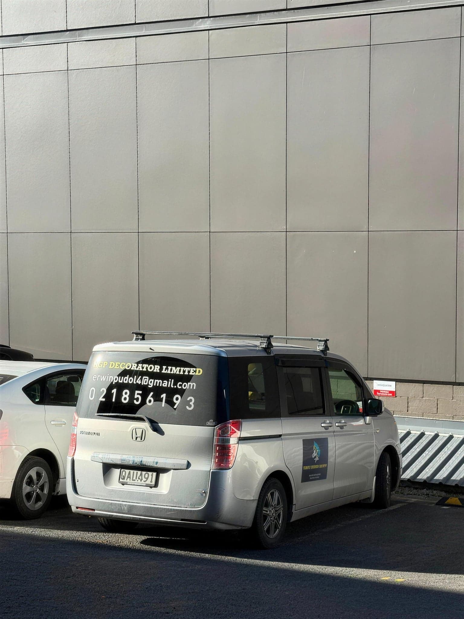 The EGP Decorator Limited van, signwritten with the company logo and contact details