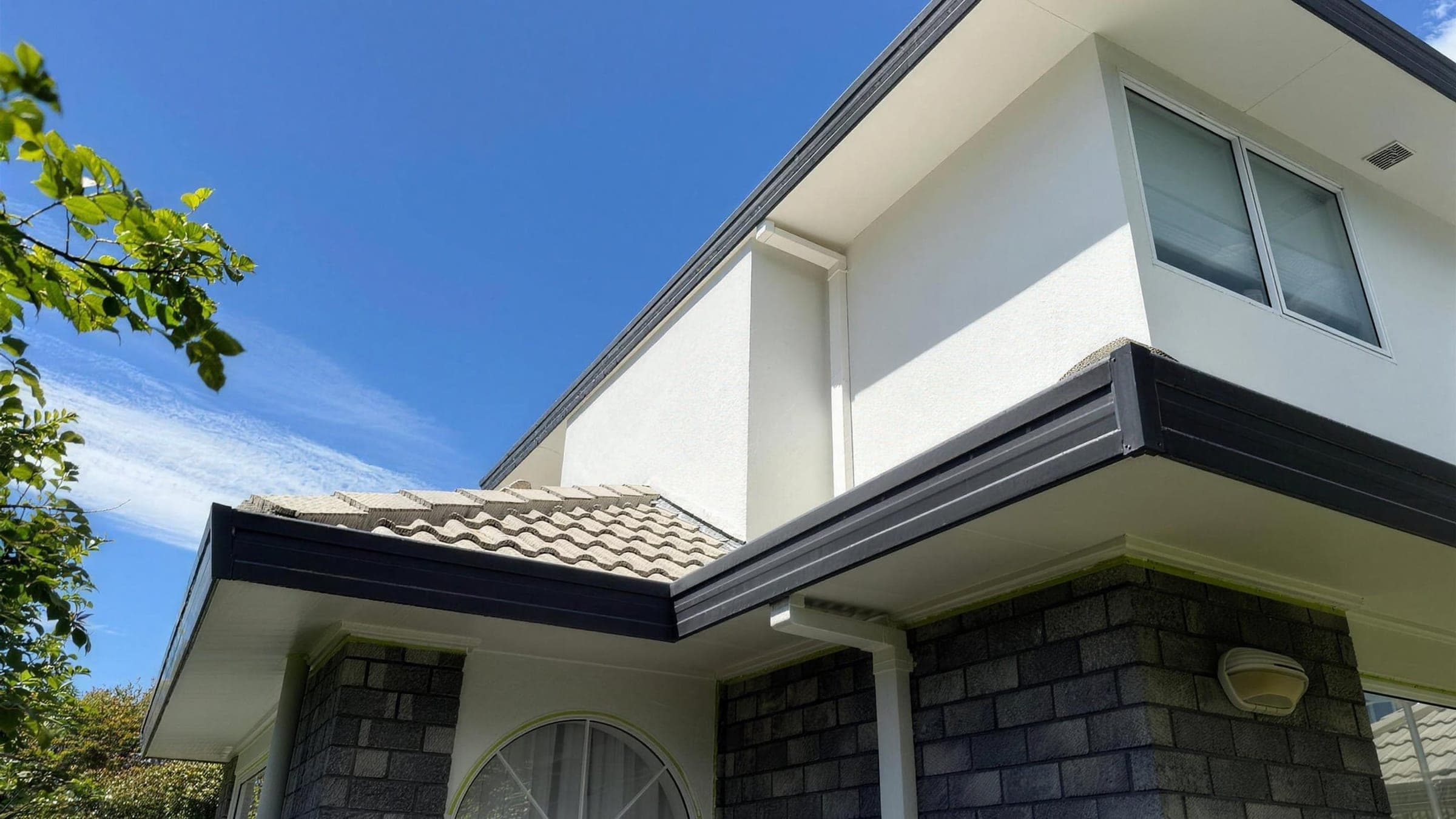 A freshly painted two-storey weatherboard home finished by EGP Decorator Limited